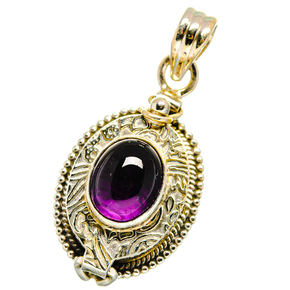Sterling silver amethyst oval pendant with ornate bezel and hanging bail