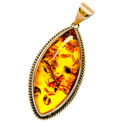 Amber teardrop pendant with rope-edged 925 sterling silver bezel and bail