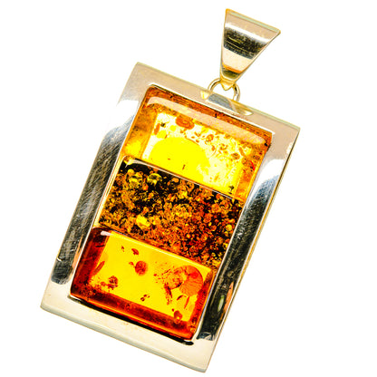 Rectangular Baltic amber pendant in polished 925 sterling silver frame with gold bail