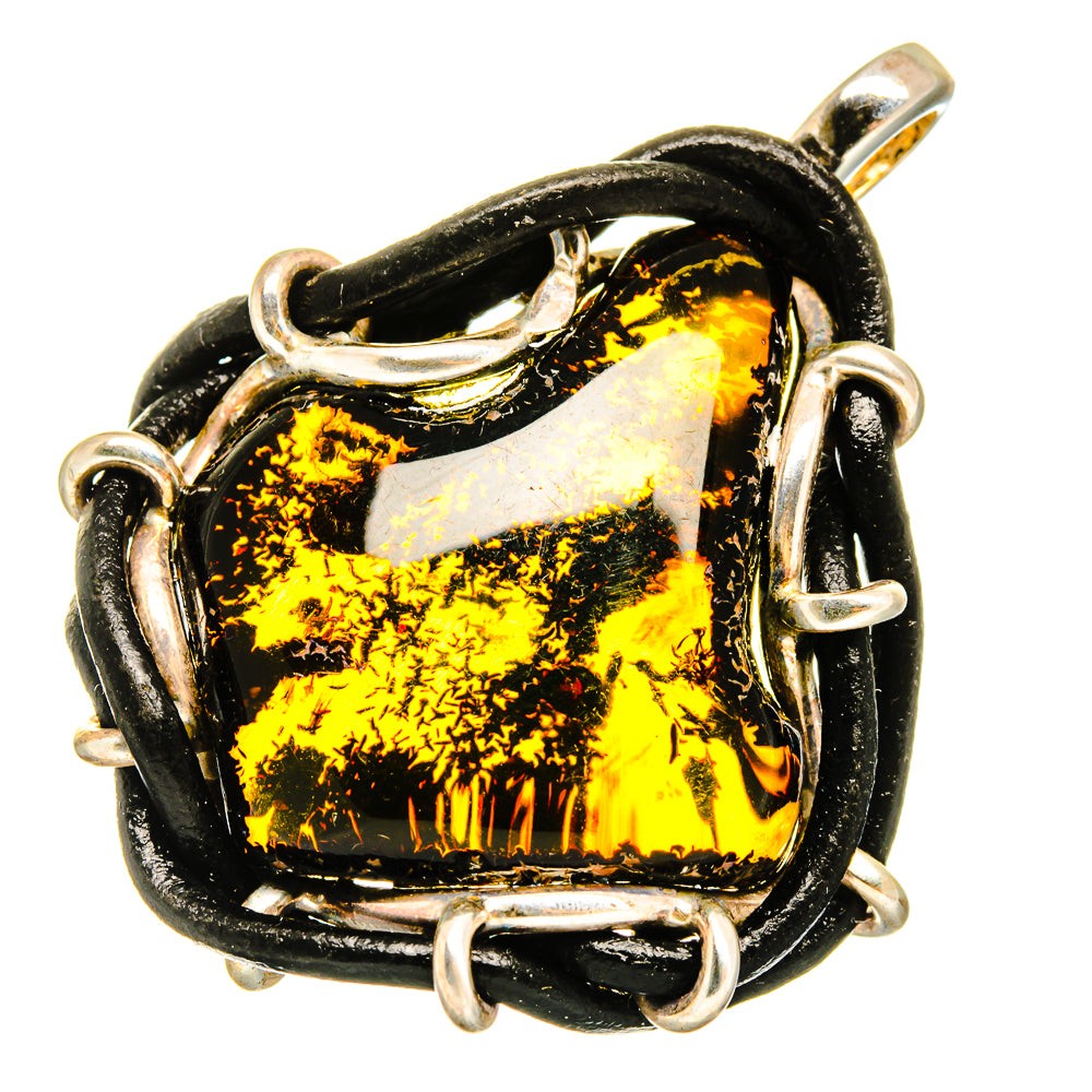 Amber pendant with black-and-gold stone, sterling silver bezel and bail loops