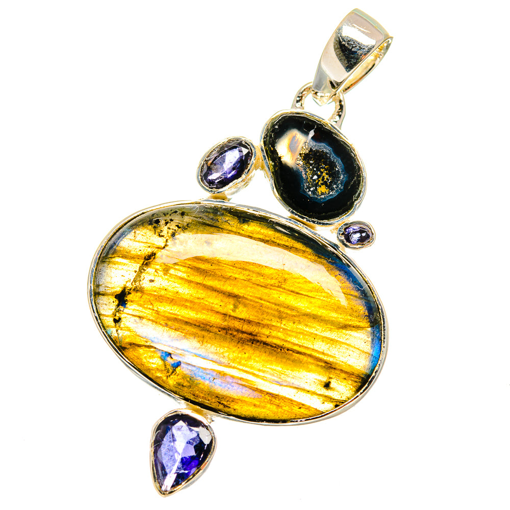 Oval iridescent gemstone pendant with dark bezel, accented by four small purple stones.