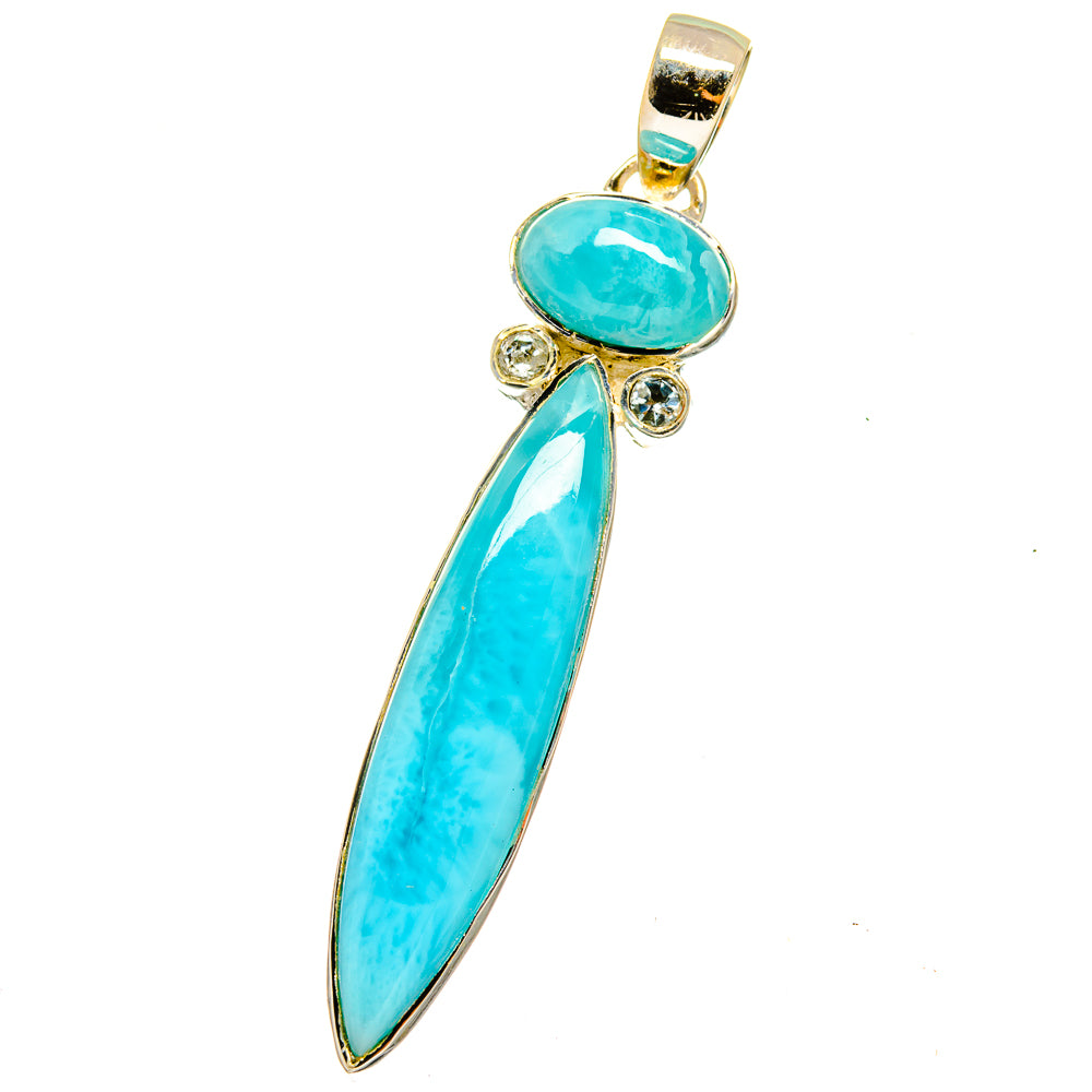 Turquoise gemstone pendant with oval center and elongated drop, gold-tone setting.