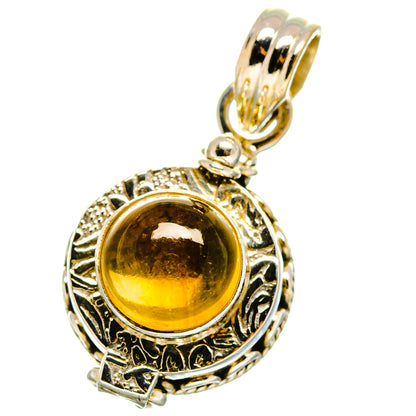 Sterling silver citrine pendant with round amber gemstone and ornate bezel
