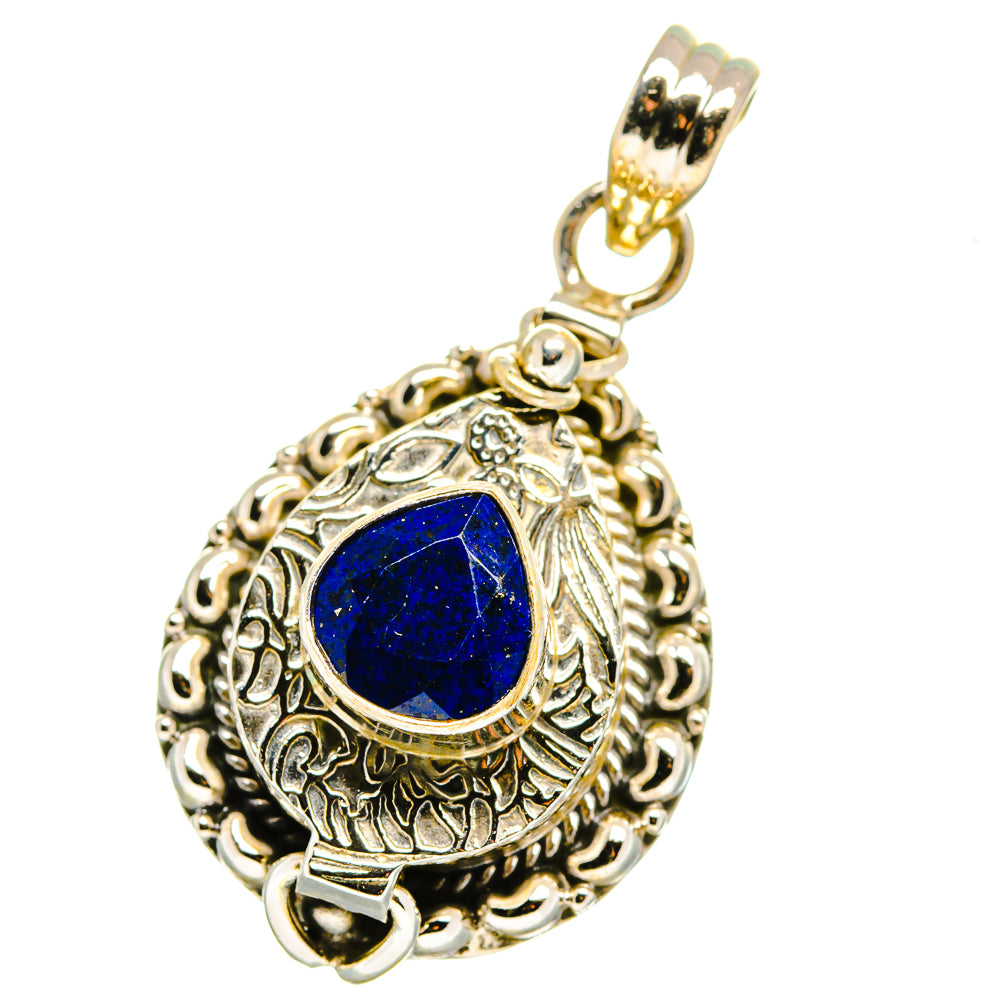 Sterling silver lapis lazuli pendant, blue cabochon in filigree oval with chain loop