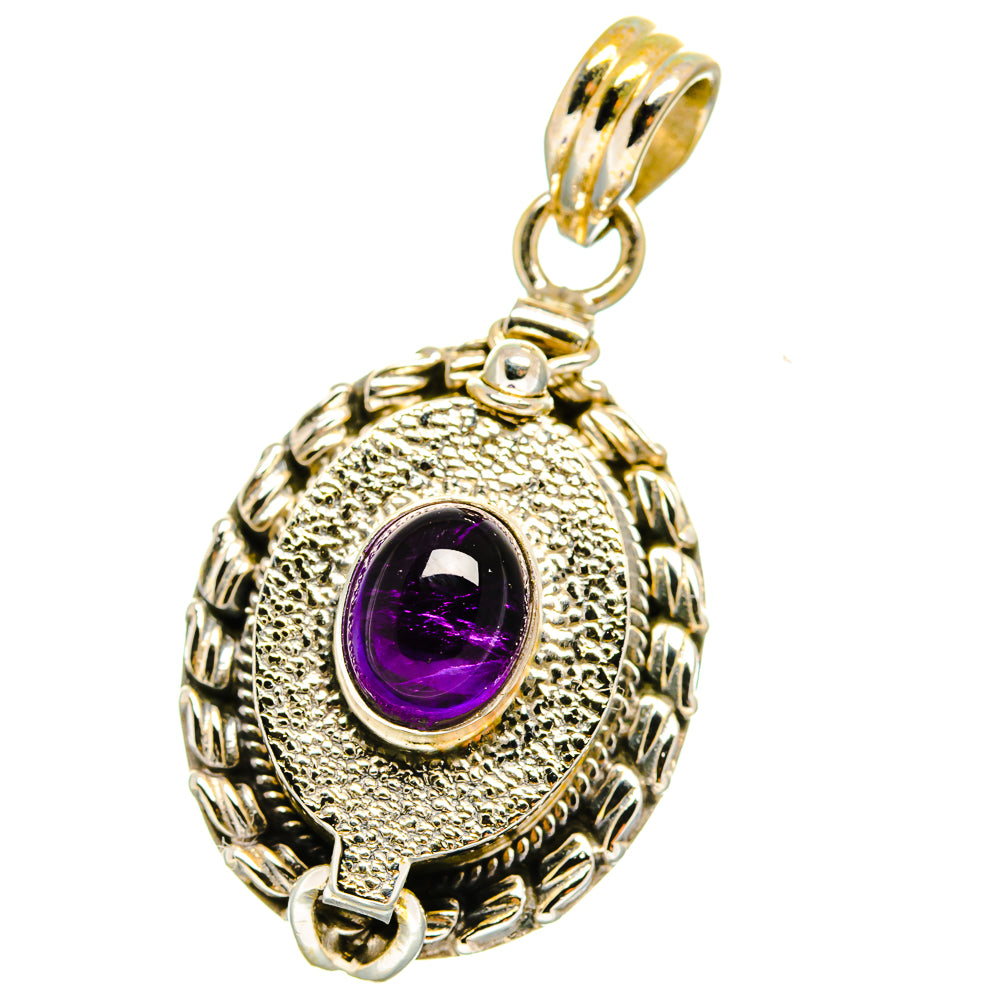 Amethyst pendant with ornate oval silver casing and purple cabochon, top bail loop.