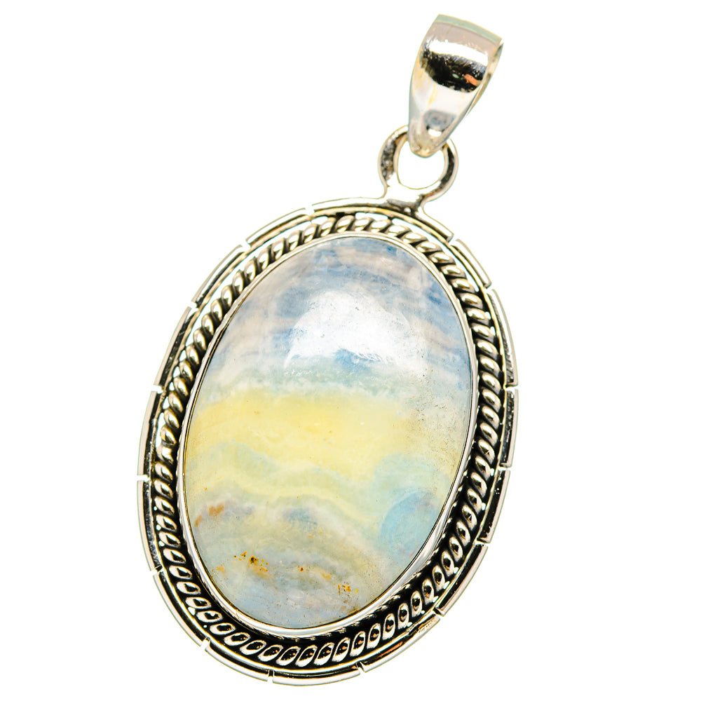 Oval blue scheelite pendant with ornate sterling silver frame and hanging bail