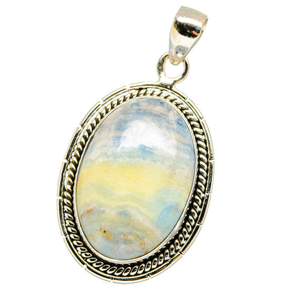Oval blue scheelite pendant with ornate sterling silver frame and hanging bail