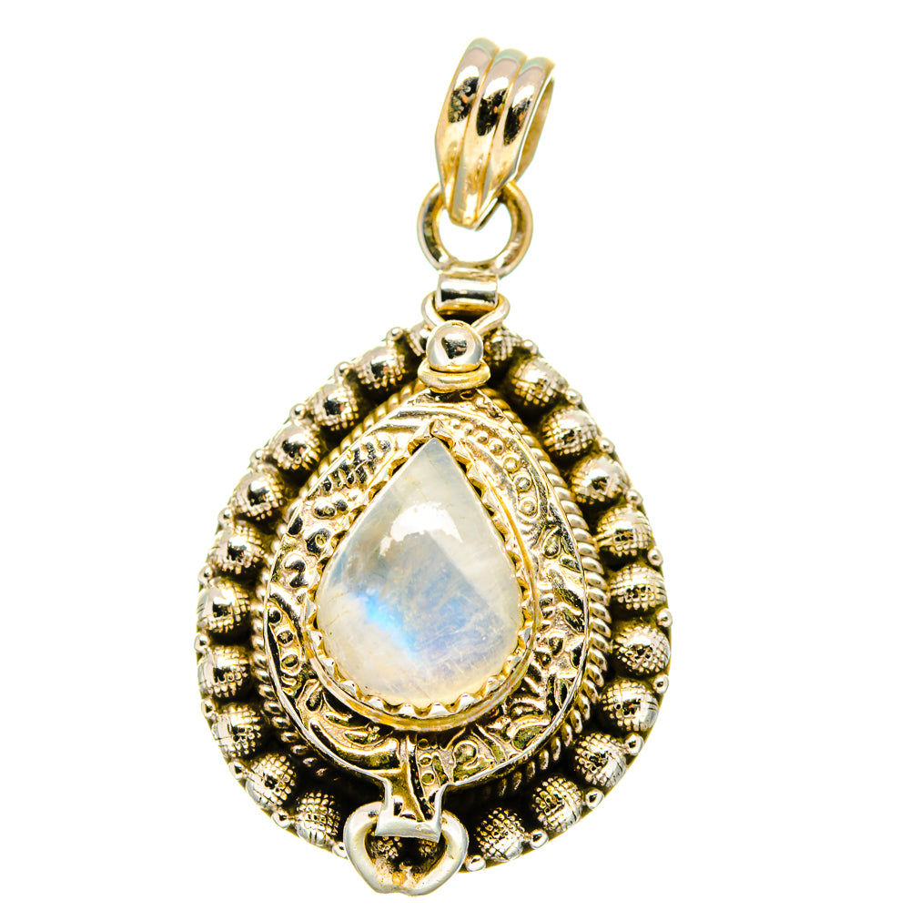 Ornate teardrop sterling silver pendant with iridescent moonstone-like center
