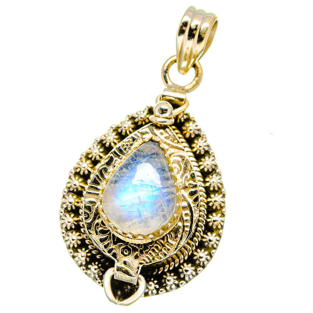 Sterling silver teardrop pendant with rainbow moonstone cabochon, ornate engraved frame