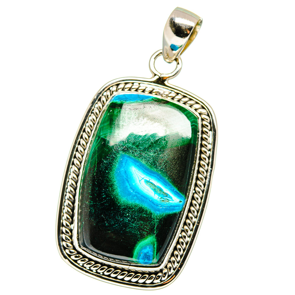 Sterling silver pendant with bezel-set rectangular green-blue stone and textured frame