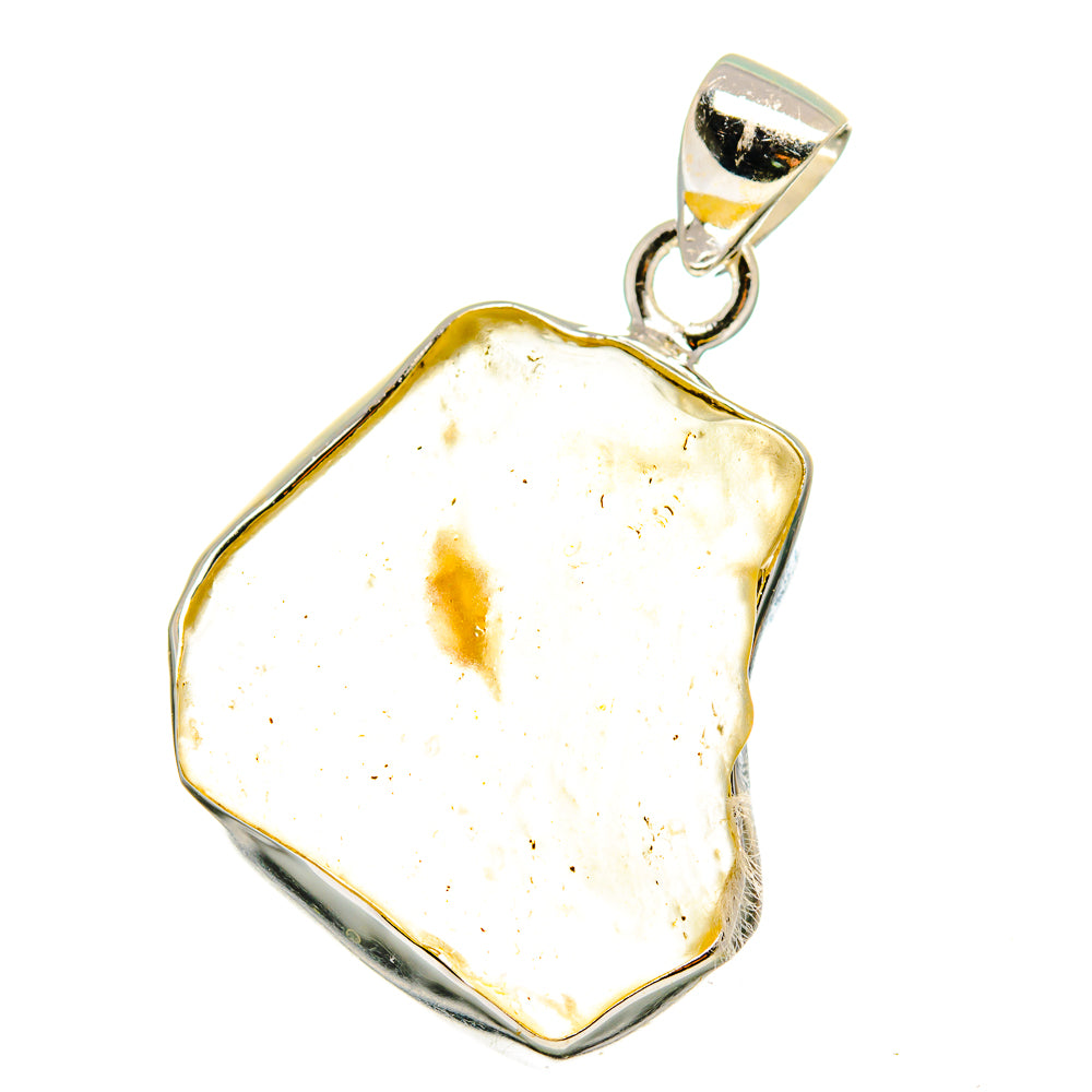 Irregular pale amber glass pendant with 925 sterling silver setting, faceted edge