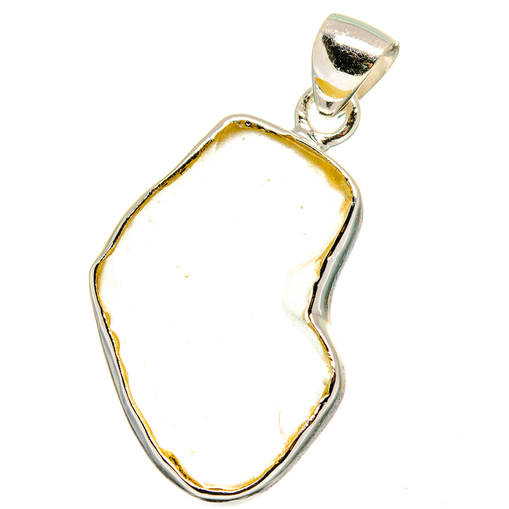 Pale desert glass pendant with yellow edge in polished sterling silver frame and bail