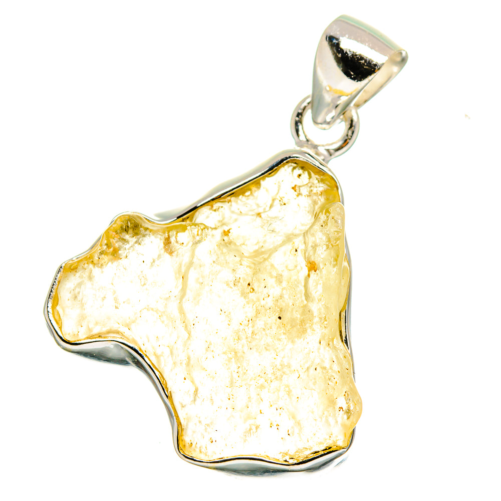 Libyan Desert Glass pendant with irregular golden stone in sterling silver bezel