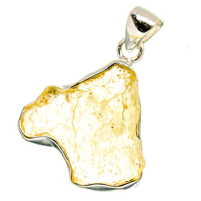 Libyan Desert Glass pendant with irregular golden stone in sterling silver bezel