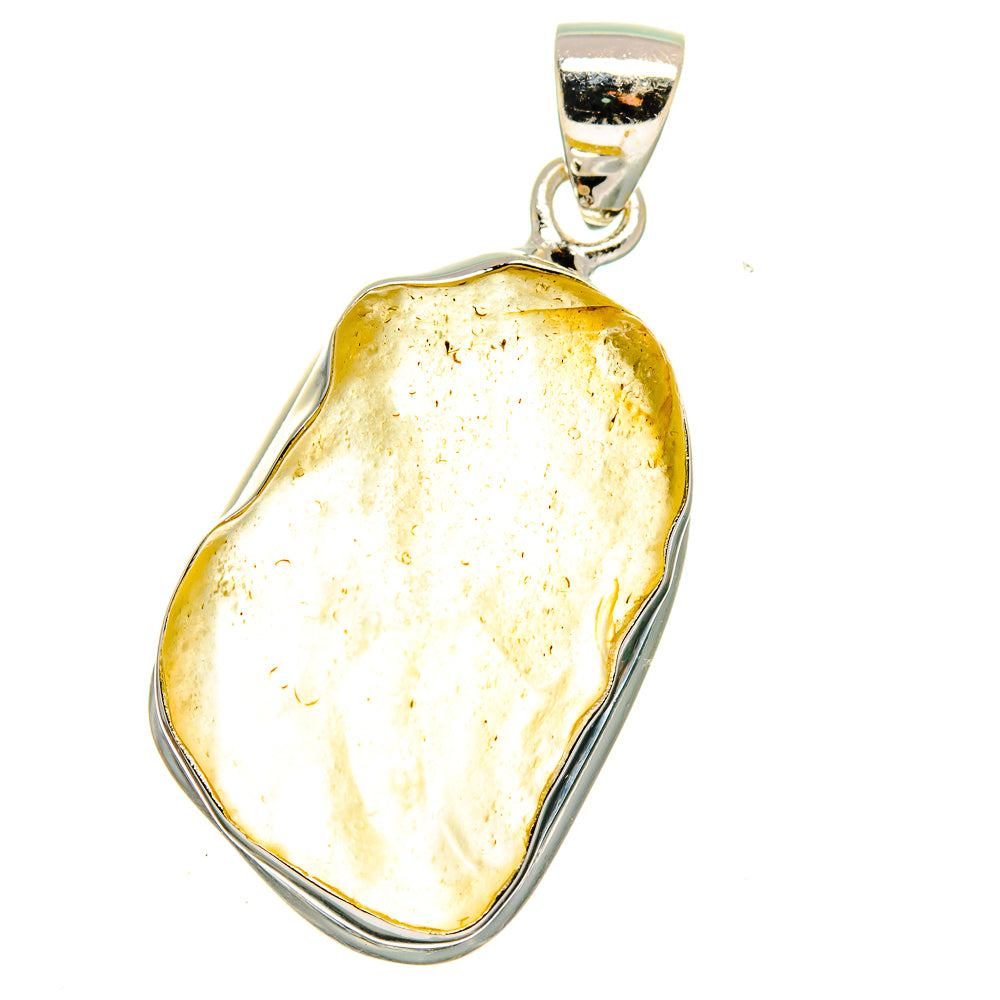 Golden Libyan Desert Glass pendant in sterling silver frame, irregular teardrop form