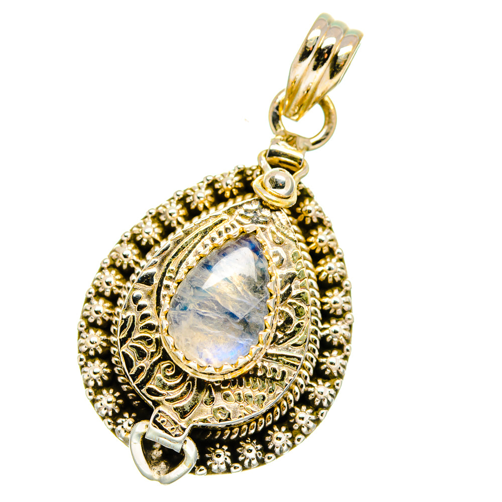 Gold-tone teardrop pendant with ornate filigree and iridescent moonstone cabochon