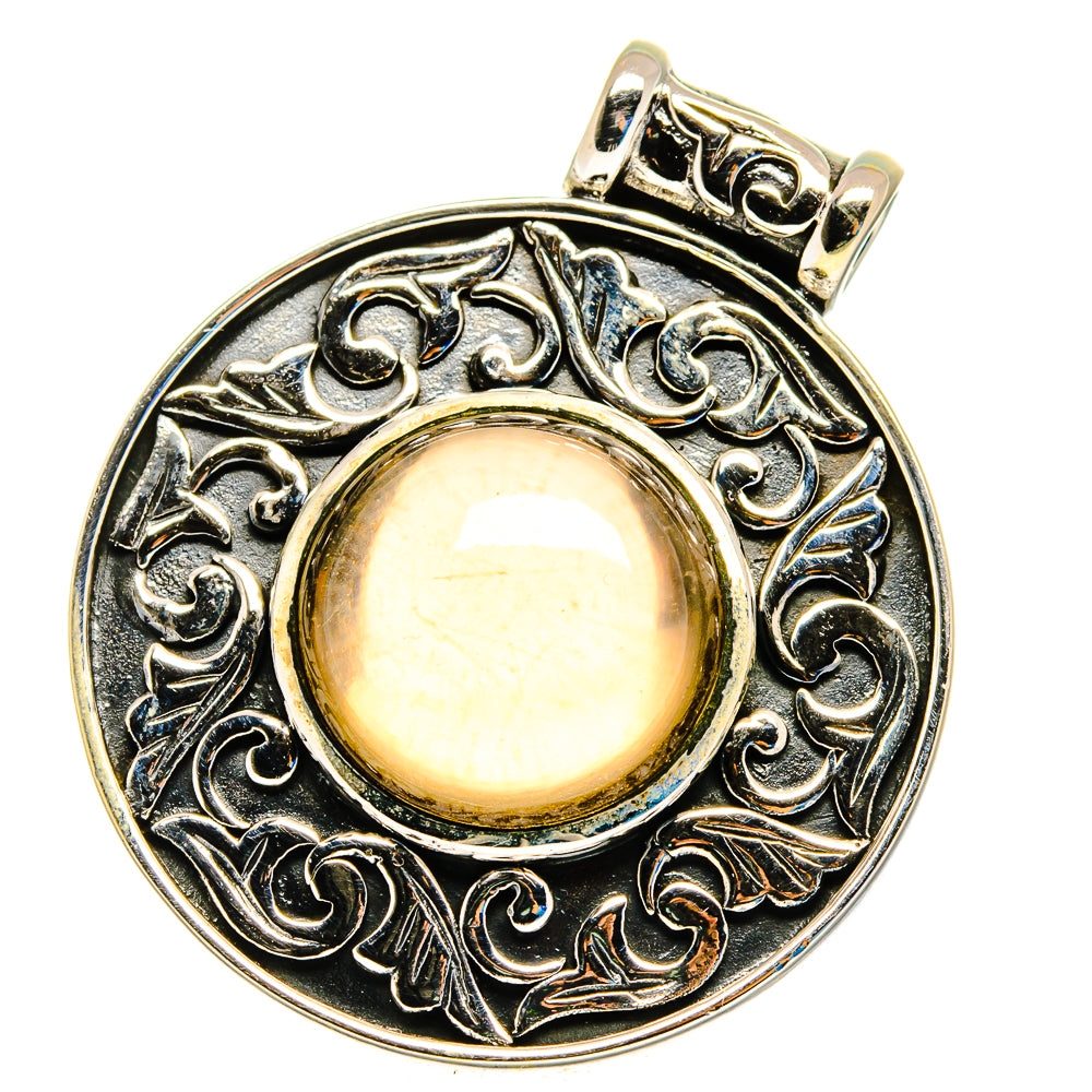 Smoky quartz pendant in sterling silver with circular filigree border and reflective cabochon