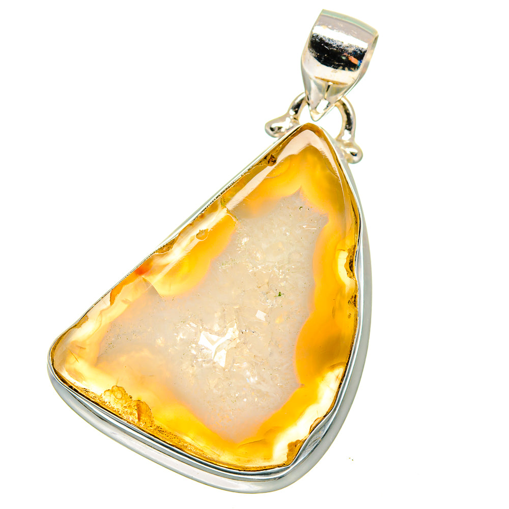 Sterling silver teardrop geode slice pendant with white crystal interior and amber rim
