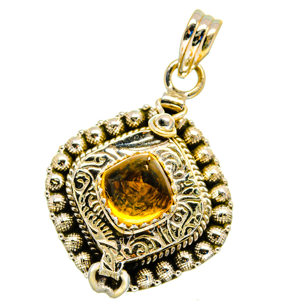 Sterling silver citrine pendant with ornate round bezel and gold-toned bail