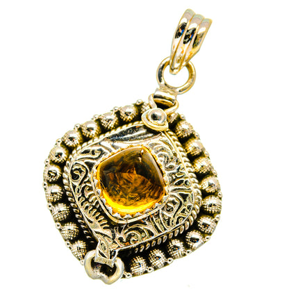 Sterling silver citrine pendant with ornate round bezel and gold-toned bail