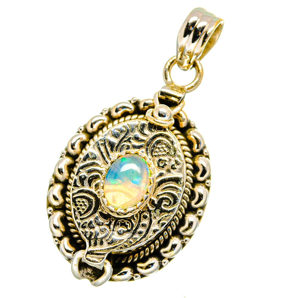 Sterling silver opal pendant with oval Ethiopian opal and ornate round filigree border