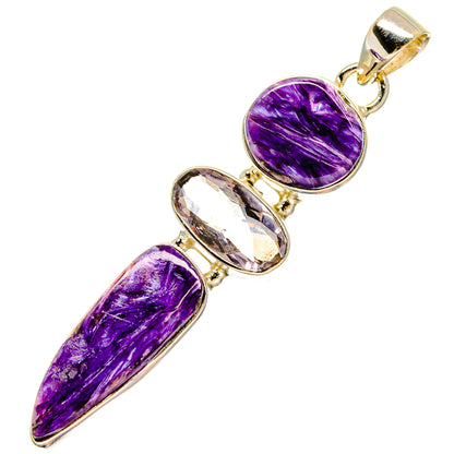 Purple gemstone pendant with oval and pear-shaped stones in gold-tone setting
