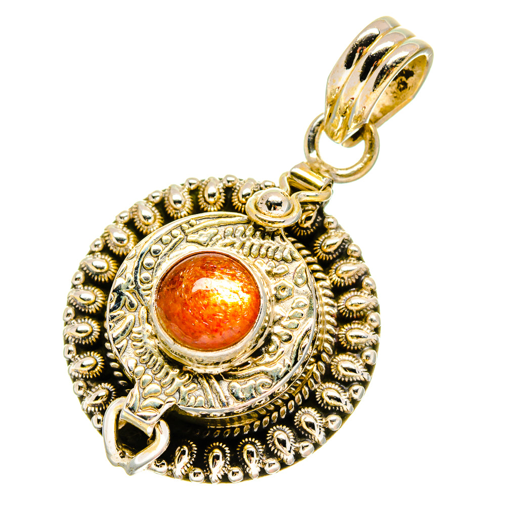 Orange sunstone pendant with detailed filigree border and 925 sterling silver loop bail