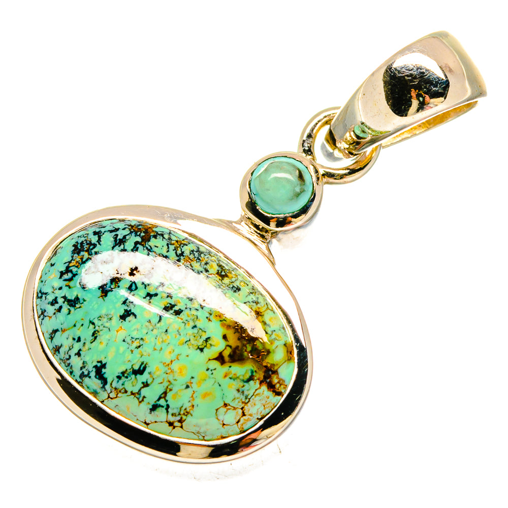 Oval turquoise pendant with small round turquoise accent in gold-tone bezel