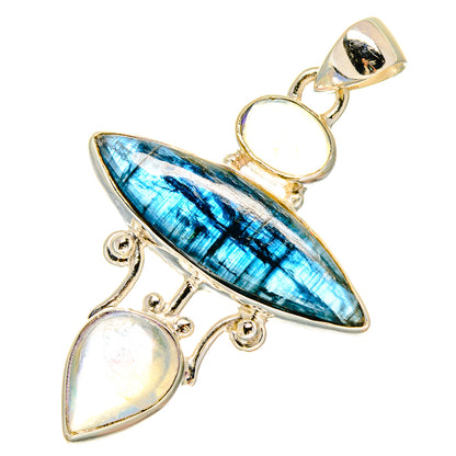 Silver-tone pendant with blue teardrop stone and two iridescent moonstone cabochons