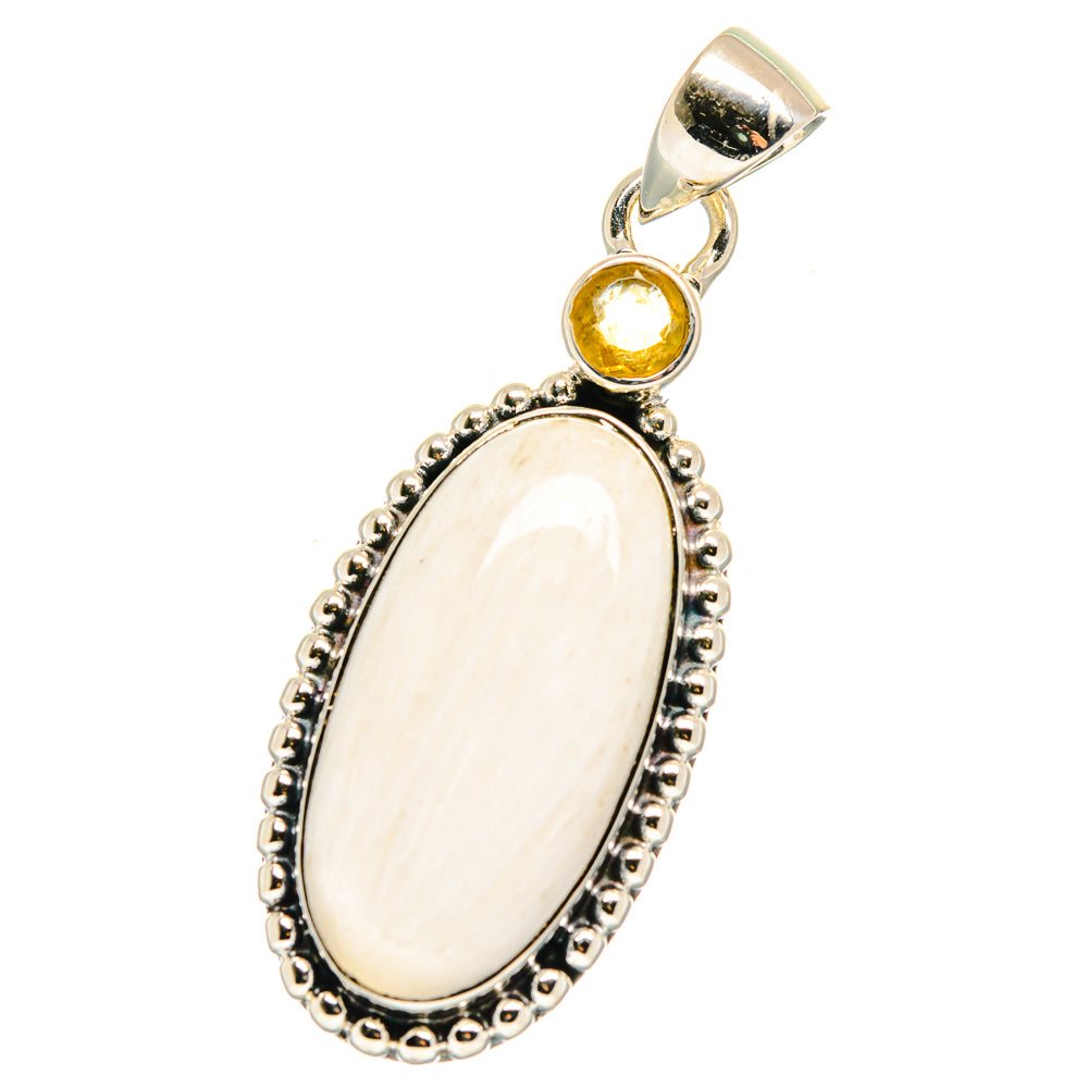 Silver pendant with large oval white cabochon and small round yellow citrine accent