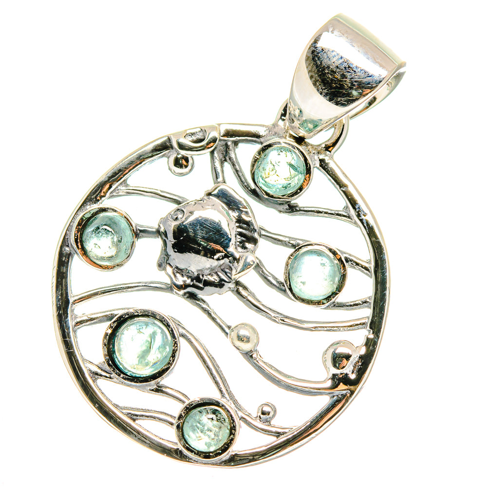 Aquamarine pendant in sterling silver, circular filigree with multiple round light-blue stones.