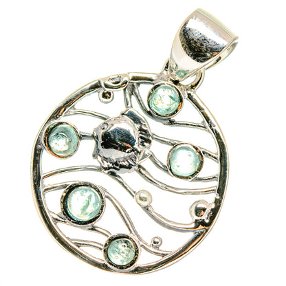 Aquamarine pendant in sterling silver, circular filigree with multiple round light-blue stones.
