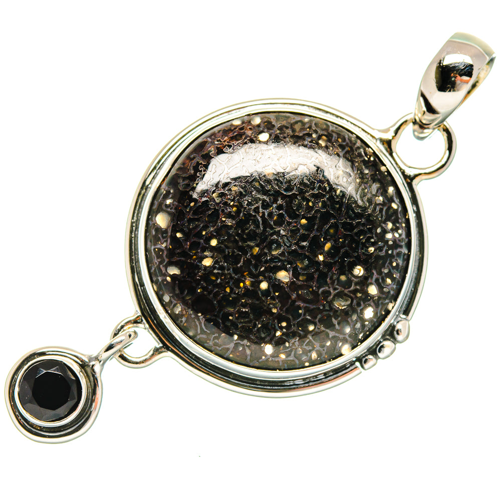 Round black stone pendant in silver bezel with small black charm on side