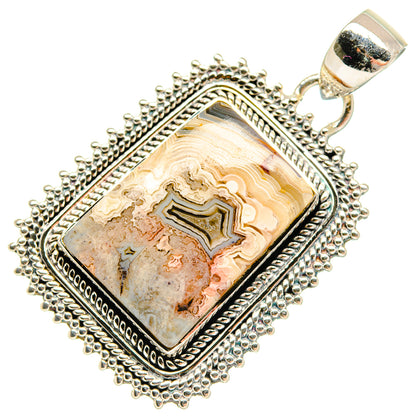 Sterling silver lace agate rectangular pendant with ornate bezel and textured frame