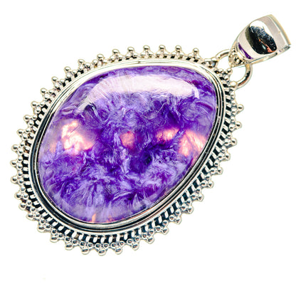 Oval charoite pendant with purple gemstone set in sterling silver with beaded border