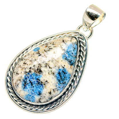 Sterling silver teardrop azurite pendant with braided frame and blue-and-white stone
