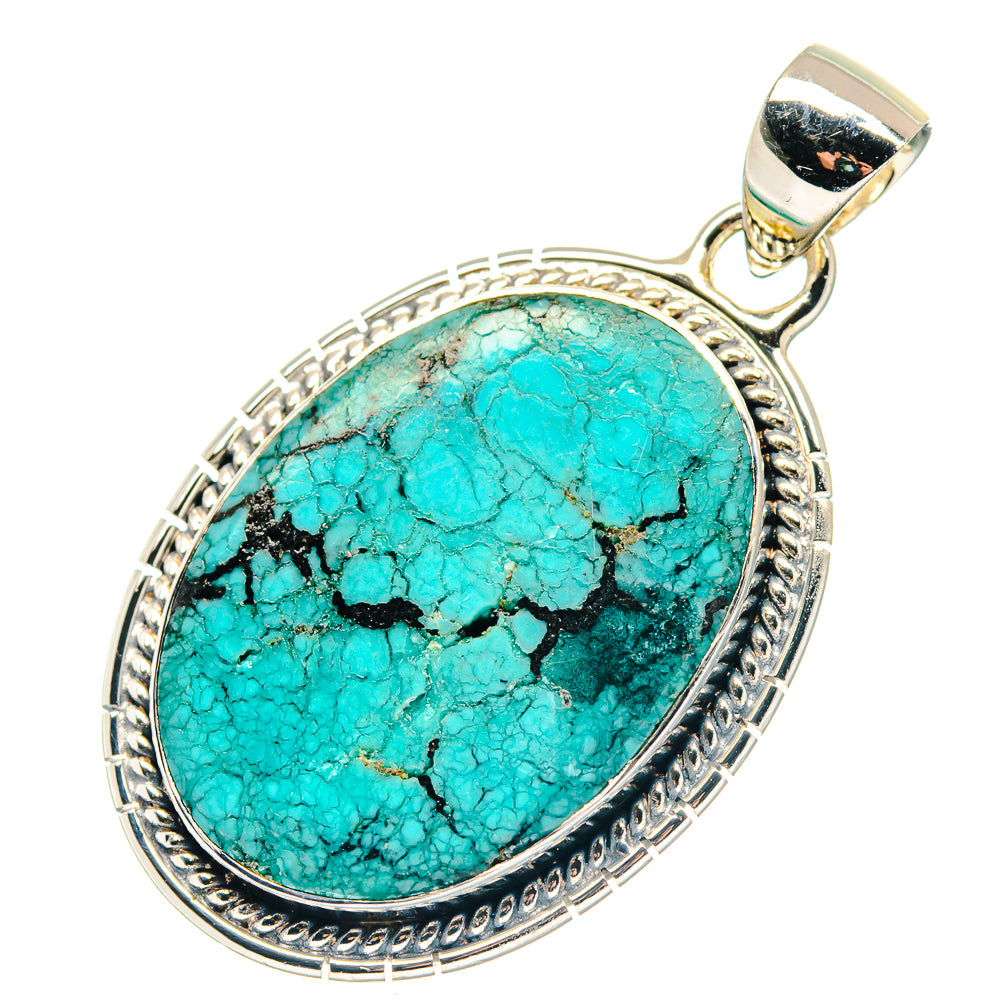 Sterling silver pendant with oval turquoise cabochon and engraved bezel
