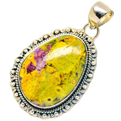 Sterling silver oval pendant with yellow-green cabochon and ornate bezel