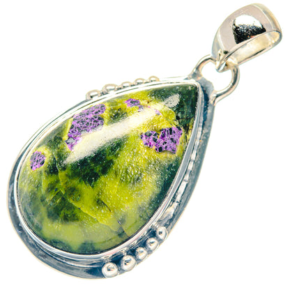Sterling silver teardrop pendant with green/yellow stone, purple flecks, decorative border