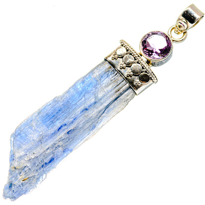 Rough blue crystal pendant with faceted purple gemstone in ornate 925 silver setting