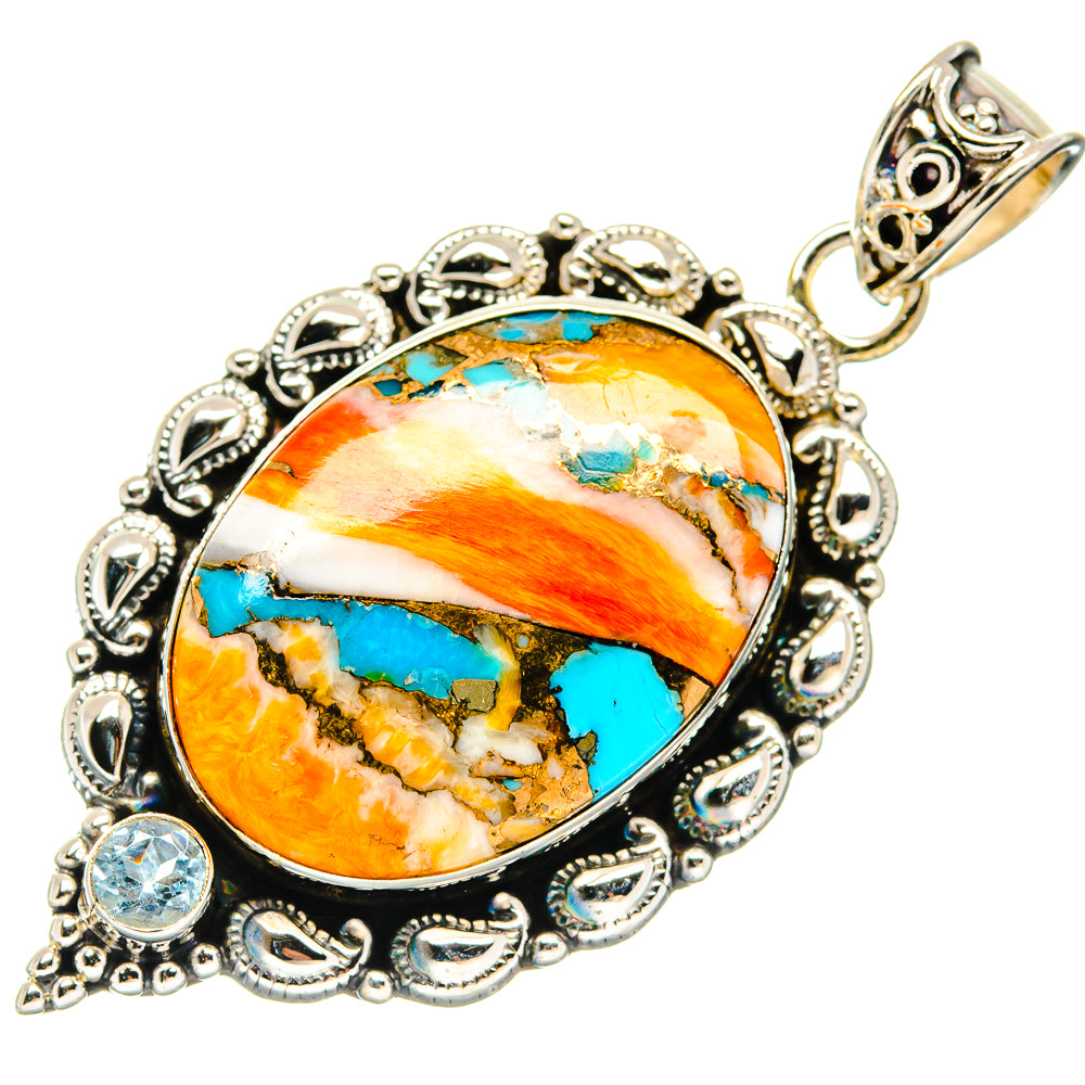 Turquoise and orange oval cabochon pendant with ornate silver filigree and blue accents