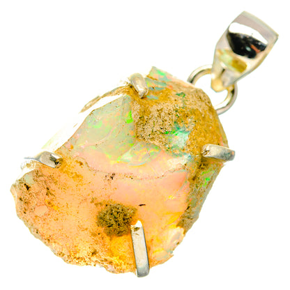Rough opal pendant with sterling silver bail and prong-like bezel over multicolor stone