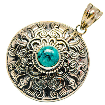 Round 925 sterling silver pendant with turquoise cabochon and ornate engraved border