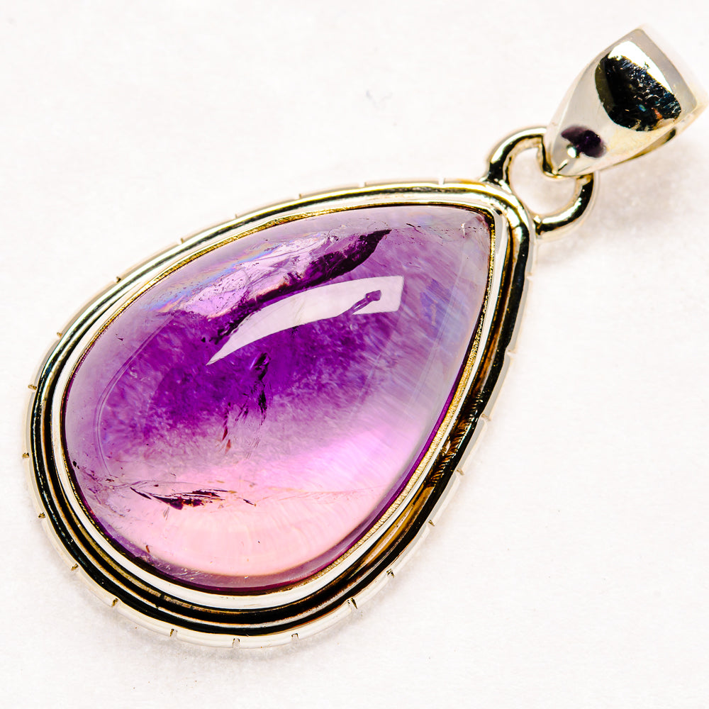Teardrop amethyst pendant in sterling silver, purple cabochon with top bail
