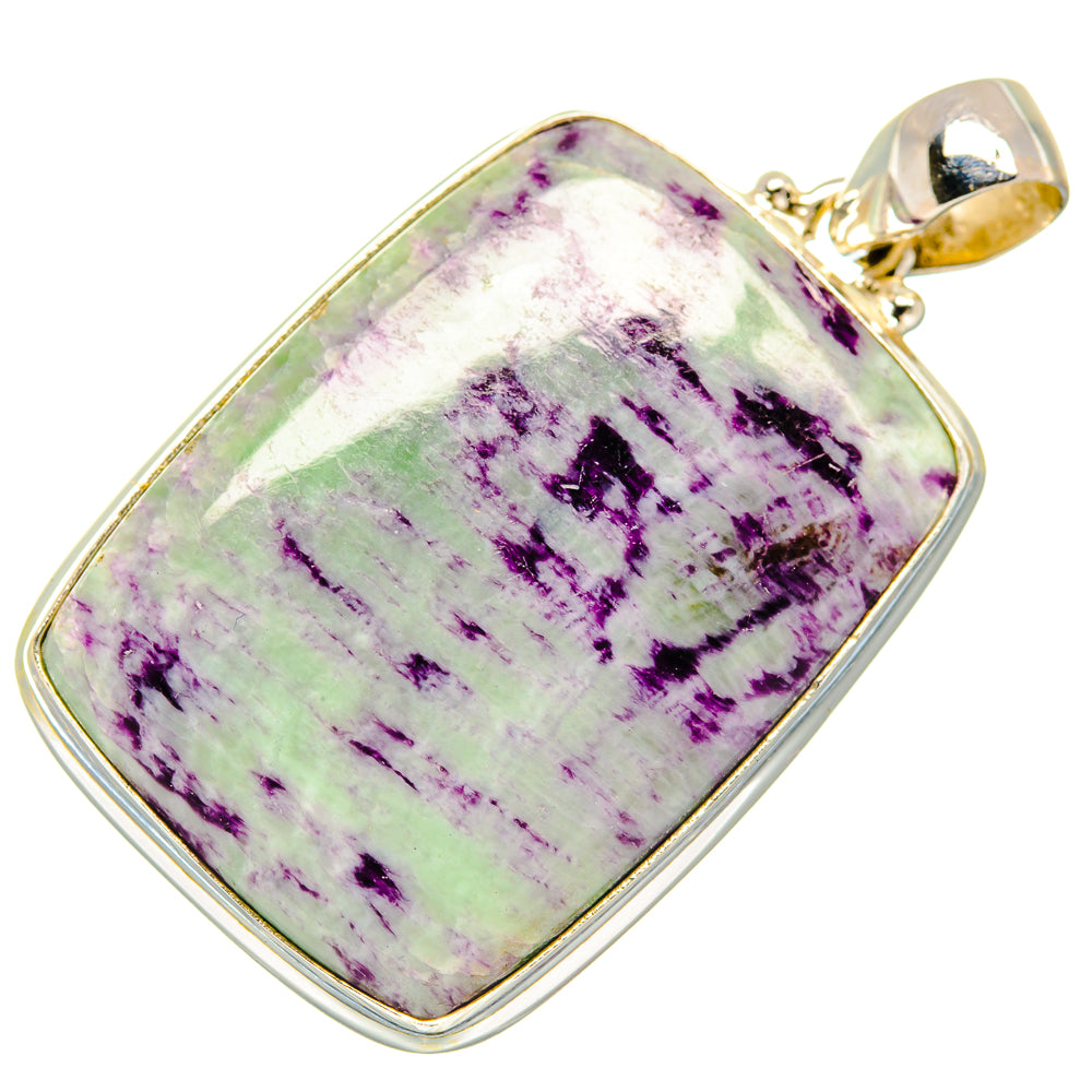 Rectangular 925 sterling silver pendant with purple-green kammererite stone and gold bail.