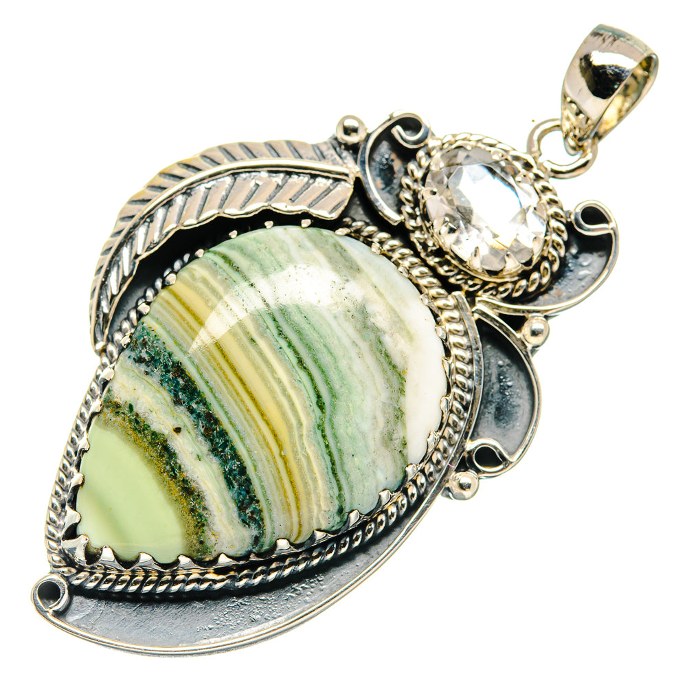 Sterling silver pendant with ocean jasper slice, clear accent stone and ornate bezel setting