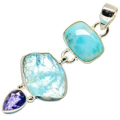 Sterling silver pendant with oval turquoise gemstone, rough light-blue stone, and purple accent