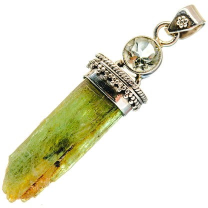 Sterling silver pendant with rough green crystal, round faceted green gemstone, bail