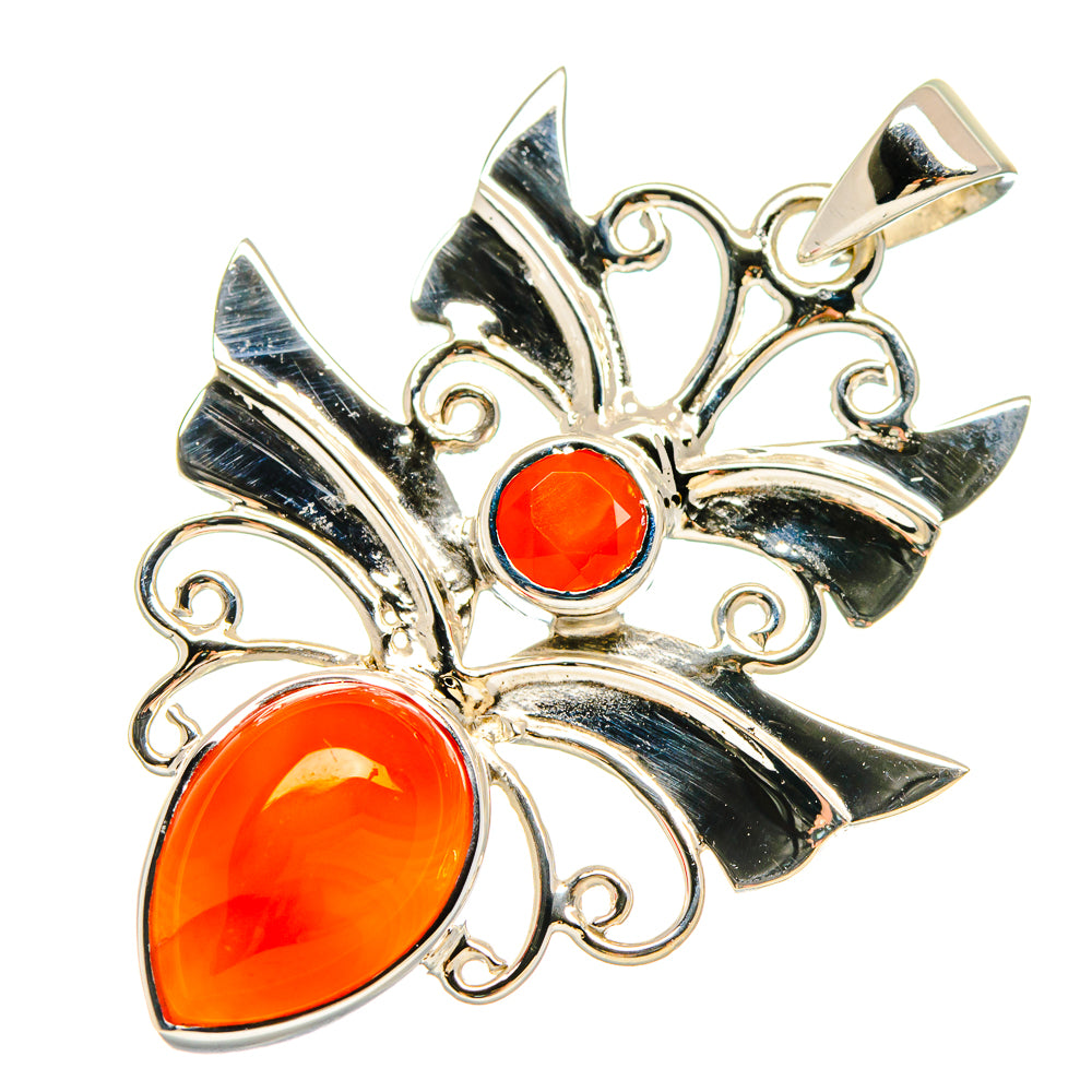 Sterling silver carnelian pendant with three orange-red stones and scrollwork frame
