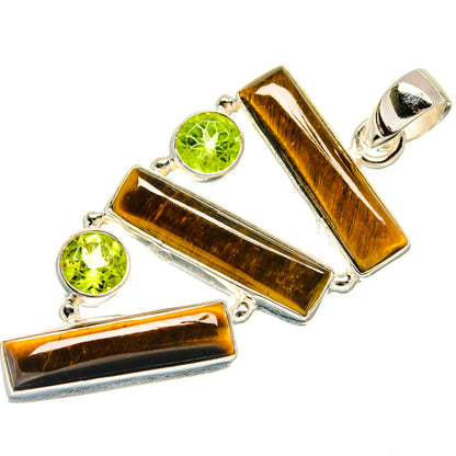 Sterling silver pendant with three tiger eye bars and two round peridot stones